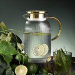 Glass cold water kettle with golden stainless steel cover