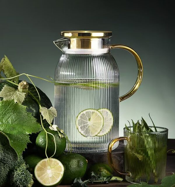 Glass cold water kettle with golden stainless steel cover